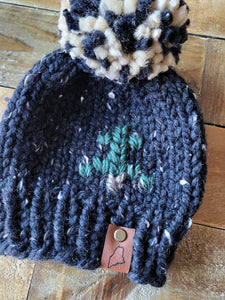 Lemon Tree Lane Baby Beanie 3-6 Months | Pine Tree Baby Beanie- Black Tweed with Tree design and Black/Tan Puff Pom Pom