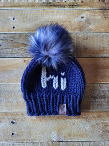 Lemon Tree Lane Youth Beanie 4-8 Years | Navy Blue Beanie with Wheat "Hi" accent and XL Blue/Black/White Faux Fur Pom Pom