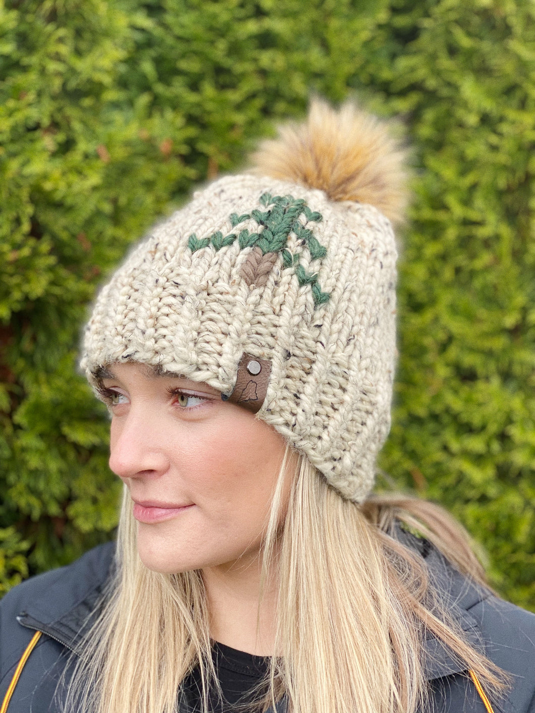 Lemon Tree Lane Adult Rustic Pines Hat | Oatmeal Tweed with Pine Tree Design/Eclipse Faux Fur Pom Pom