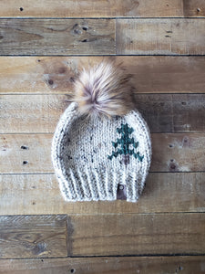 Lemon Tree Lane Adult Rustic Pines Hat | Oatmeal Tweed with Pine Tree Design/Eclipse Faux Fur Pom Pom