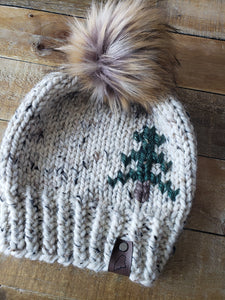 Lemon Tree Lane Adult Rustic Pines Hat | Oatmeal Tweed with Pine Tree Design/Eclipse Faux Fur Pom Pom