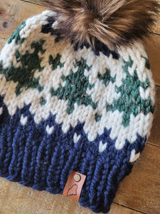 Lemon Tree Lane Adult Wintry Pines Hat | Navy Blue Brim with Pine Tree Design/Classic Striped Brown Faux Fur Pom Pom