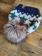 Load image into Gallery viewer, Lemon Tree Lane Adult Wintry Pines Hat | Navy Blue Brim with Pine Tree Design/Classic Striped Brown Faux Fur Pom Pom